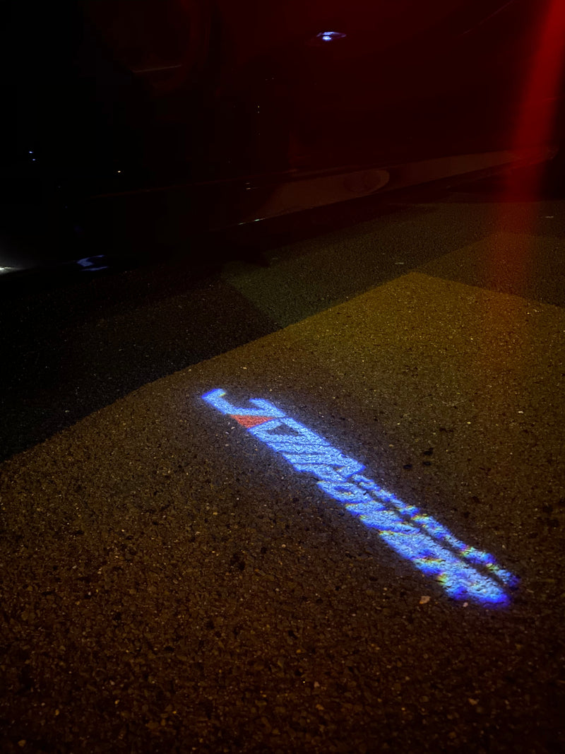 JDM LOGO PROJECTOT LIGHTS Nr.23 (quantità 1 = 1 set/2 luci per porta) 