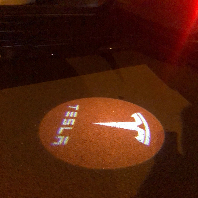 TESLA LOGO PROJECROTR LIGHTS Nr.1515 (quantità 1 = 2 pellicole logo / 2 luci per porta)