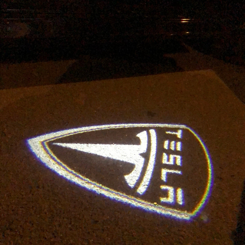 TESLA LOGO PROJECROTR LIGHTS Nr.1506 (quantità 1 = 2 pellicole logo / 2 luci porta)