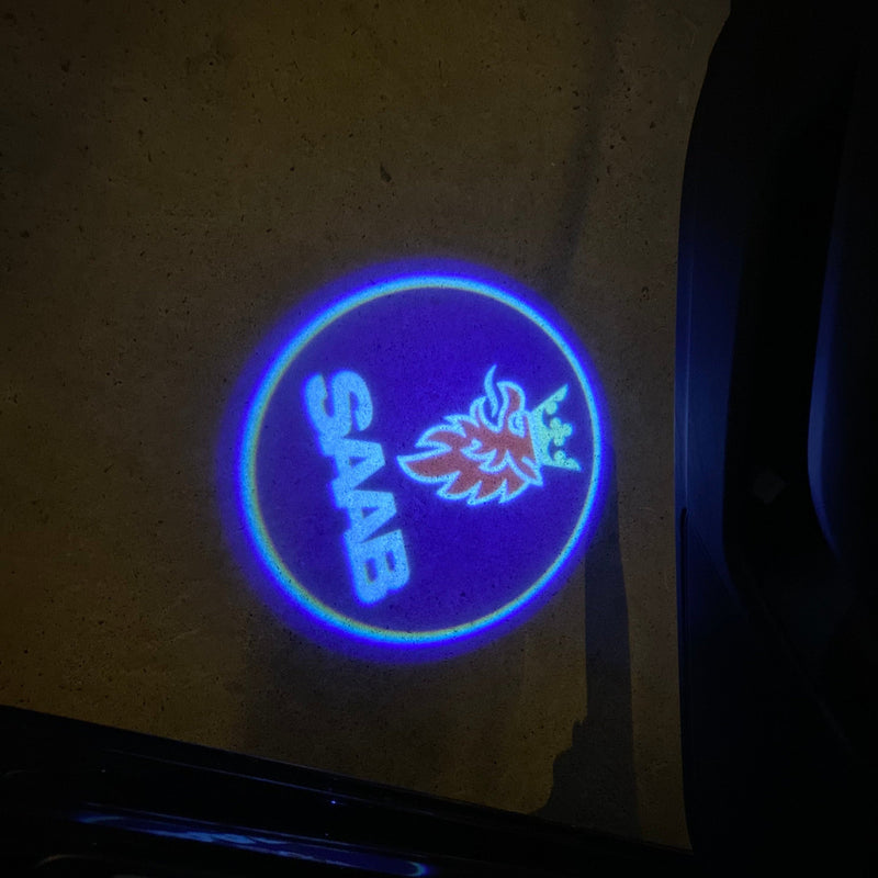 SAAB Original LOGO PROJECROTR LIGHTS Nr.2504 (quantità 1 = 1 set/2 luci porta)