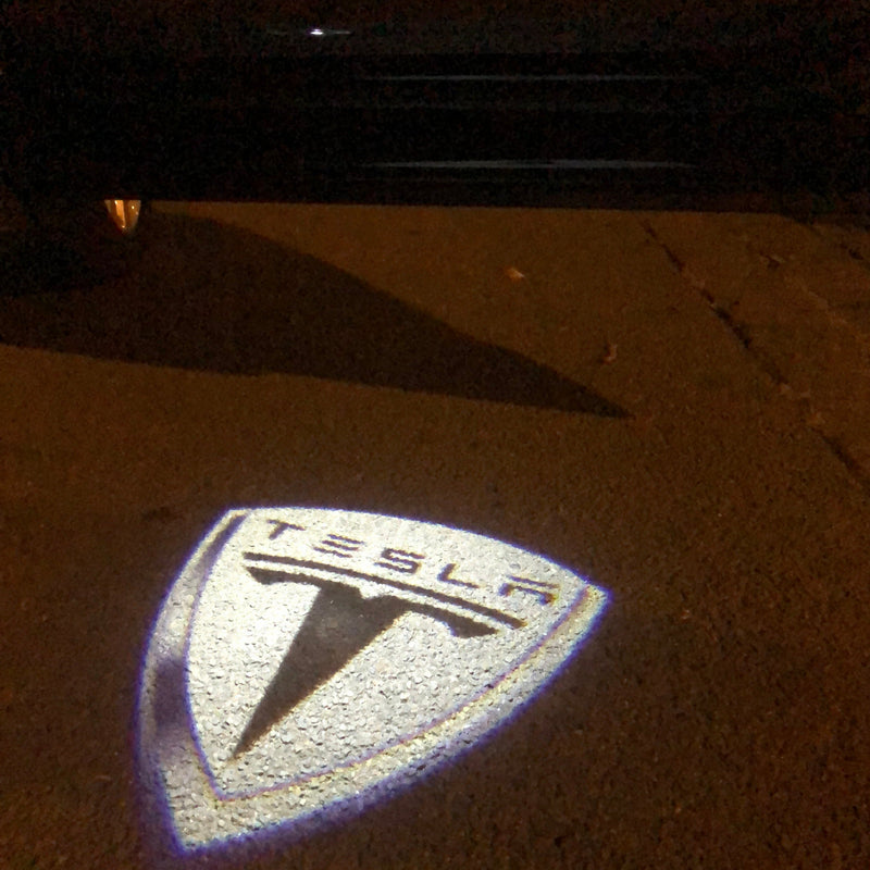 TESLA LOGO PROJECROTR LIGHTS Nr.1505 (quantità 1 = 2 pellicole logo / 2 luci per porta)