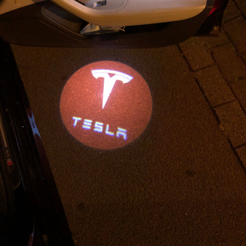 TESLA LOGO PROJECROTR LIGHTS Nr.1515 (quantità 1 = 2 pellicole logo / 2 luci per porta)