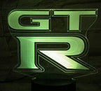 NISSAN GTR R35   LOGO PROJECTOT LIGHTS Nr.07  (quantity 1 = 2 Logo Films /2 door lights）