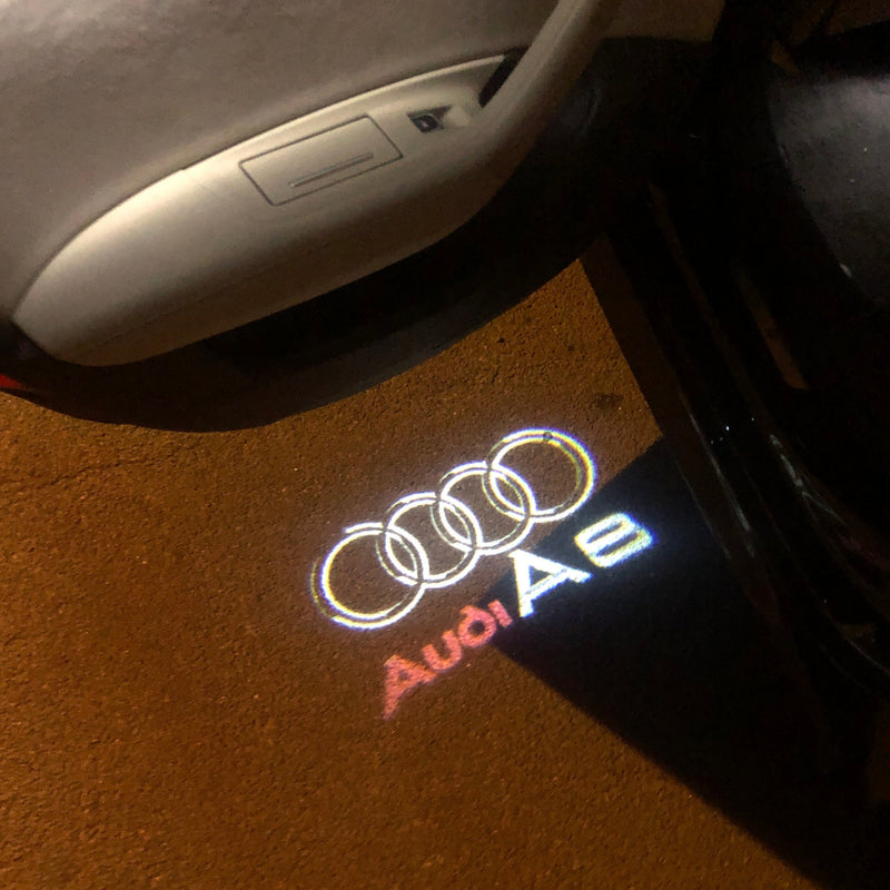 AUDI A8 LOGO PROJECTOT LIGHTS Nr.46 (quantità 1 = 2 pellicole logo /2 luci porta） 