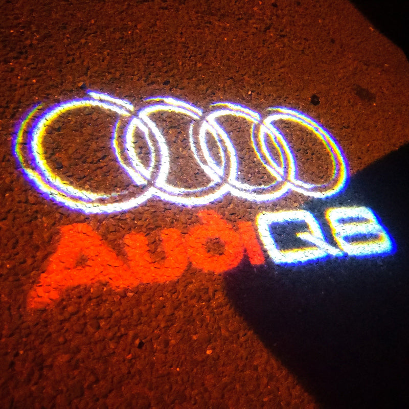 AUDI Q8 LOGO PROJECTOT LIGHTS Nr.50 (quantità 1 = 2 pellicole logo /2 luci porta） 