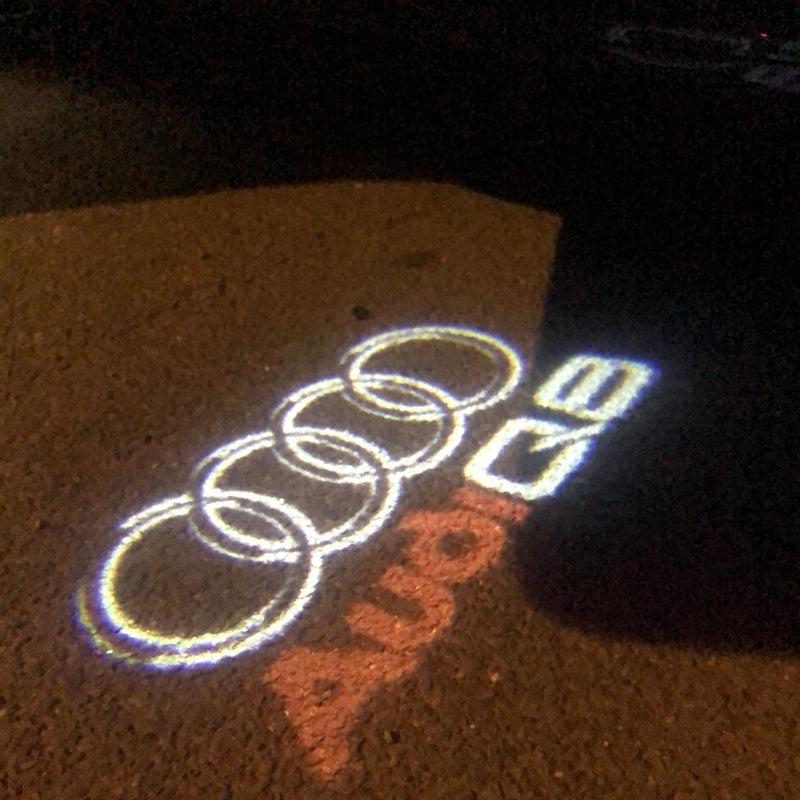 AUDI Q8 LOGO PROJECTOT LIGHTS Nr.50 (quantità 1 = 2 pellicole logo /2 luci porta） 