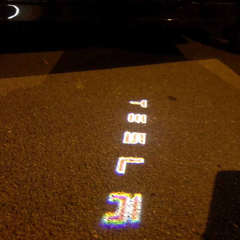 TESLA LOGO PROJECROTR LIGHTS Nr.1504 (Menge 1 = 2 Logofolie / 2 Türleuchten)