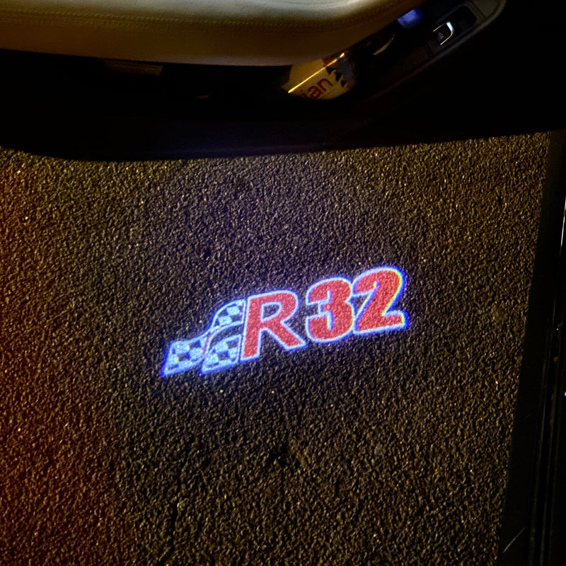 Volkswagen Luci porta R32 Logo n. 165 (quantità 1 = 2 pellicole logo / 2 luci porta)