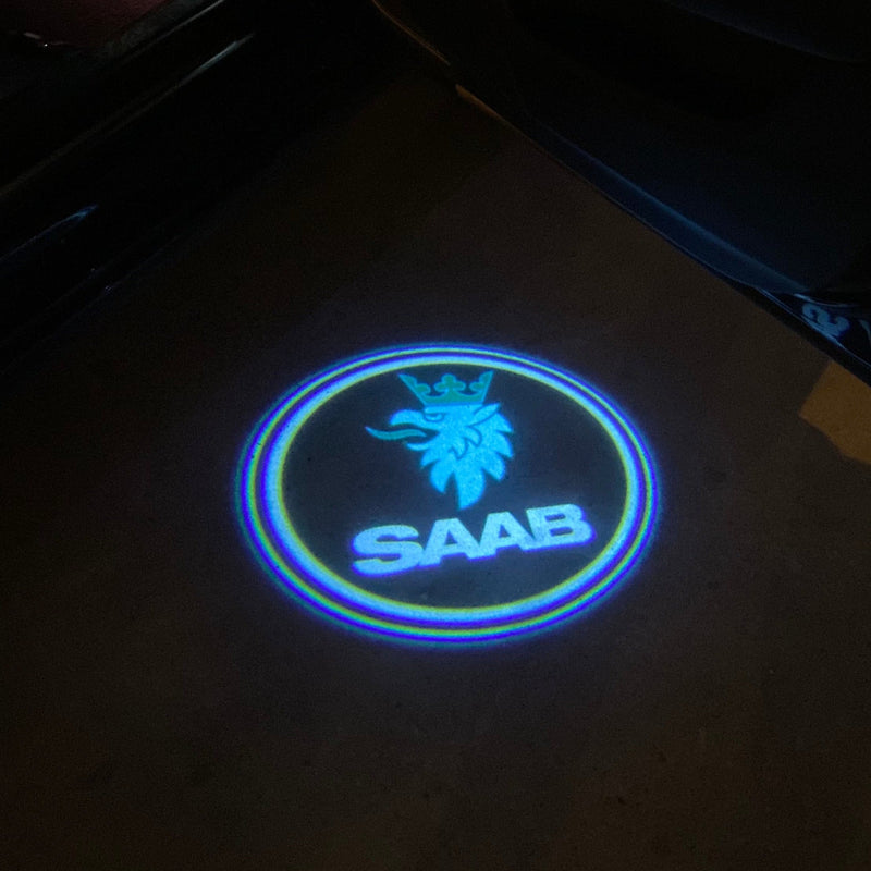 SAAB Original LOGO PROJECROTR LIGHTS Nr.25123 (quantità 1 = 1 set/2 luci porta)