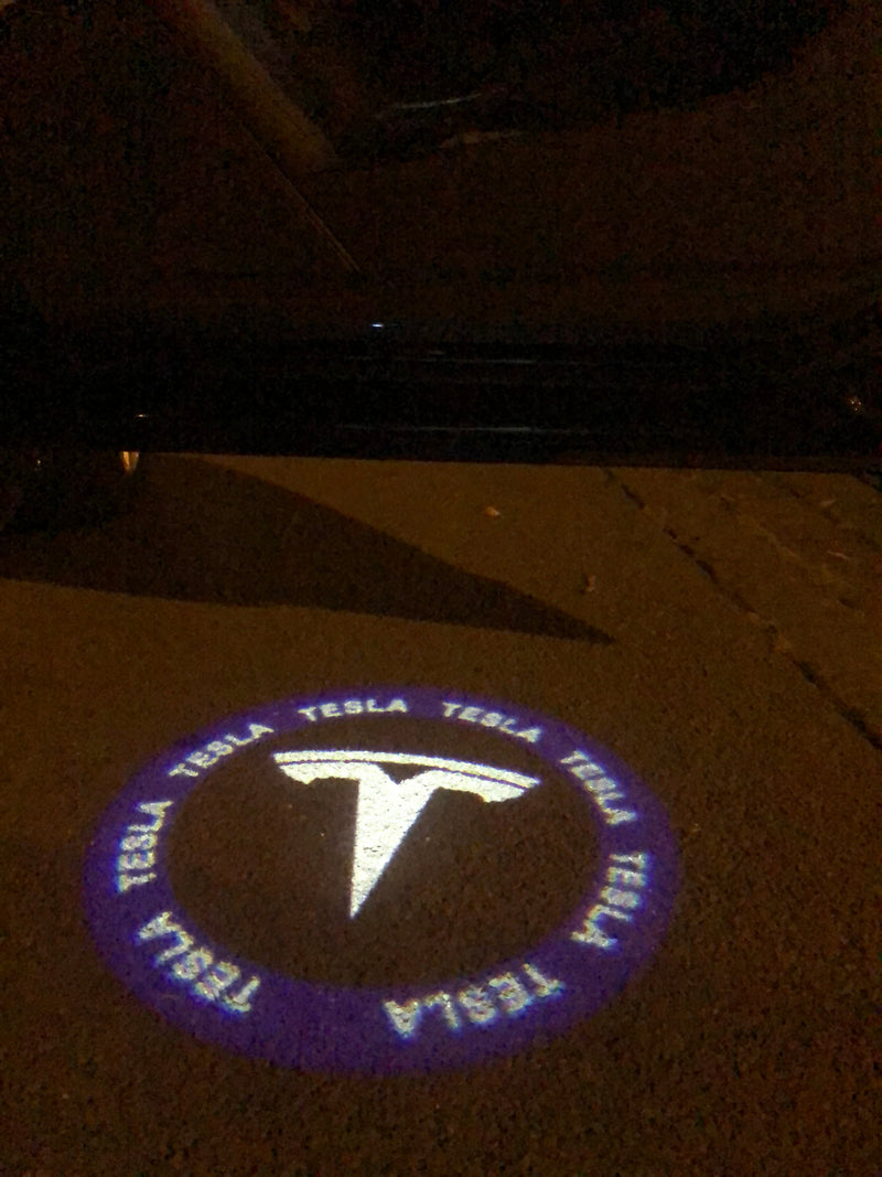 TESLA LOGO PROJECROTR LIGHTS Nr.1511 (quantità 1 = 2 pellicole logo / 2 luci per porta)