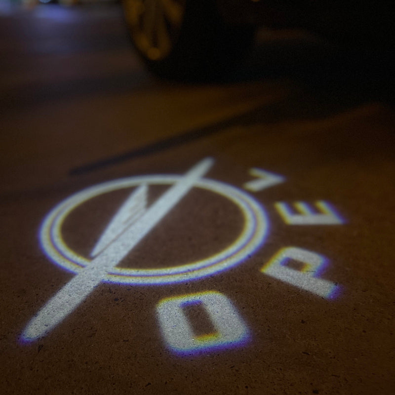 Opel Original LOGO PROJECROTR LIGHTS Nr.1434 (Menge 1 = 1 Satz/2 Türleuchten)