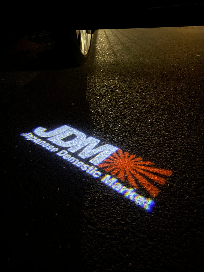 JDM LOGO PROJECTOT LIGHTS Nr.05 (quantità 1 = 1 set/2 luci per porta) 