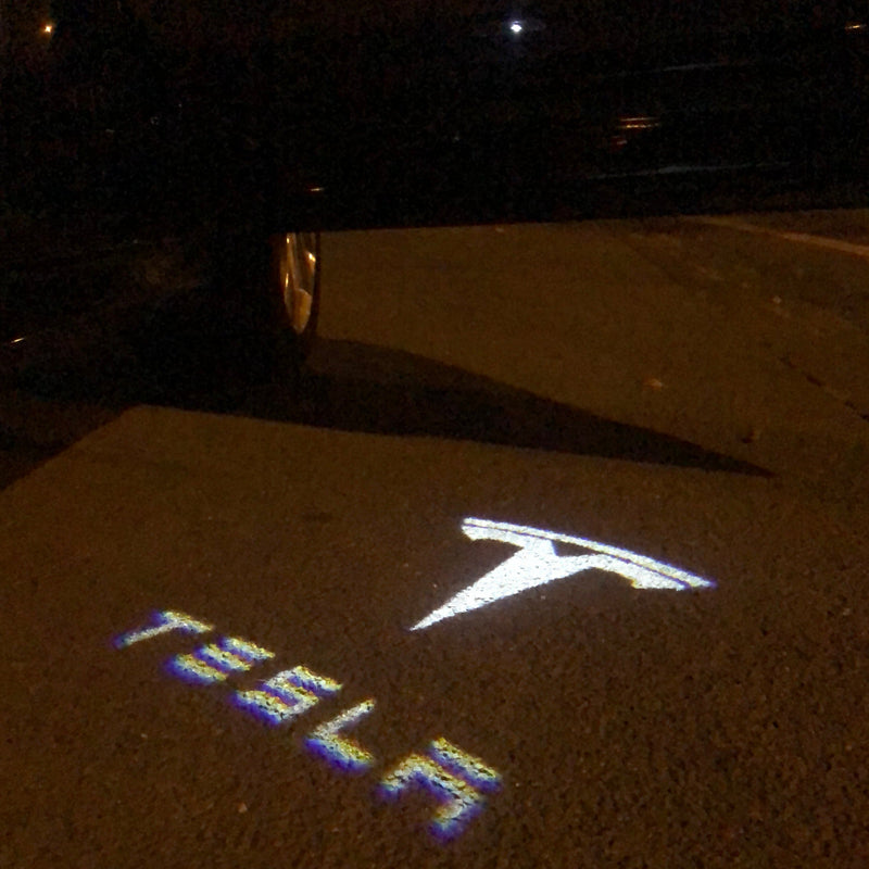 TESLA LOGO PROJECROTR LIGHTS Nr.1501 (quantità 1 = 2 pellicole logo / 2 luci per porta)