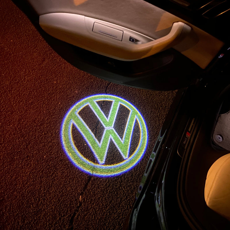 Volkswagen Luci porta Logo originale n. 159 (quantità 1 = 2 pellicole logo / 2 luci porta)