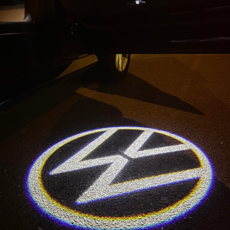 Volkswagen Luci porta Logo originale n. 162 (quantità 1 = 2 pellicole logo / 2 luci porta)