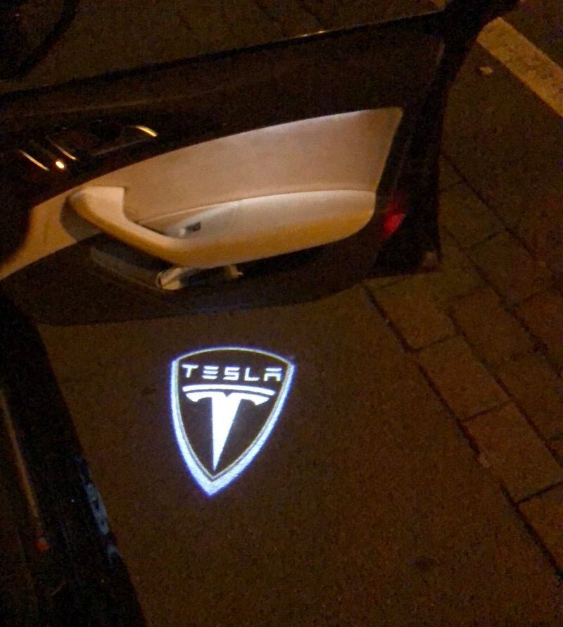 TESLA LOGO PROJECROTR LIGHTS Nr.1506 (quantità 1 = 2 pellicole logo / 2 luci porta)