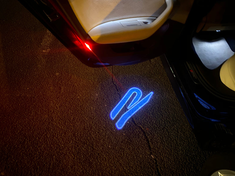 Volkswagen Luci porta R Logo Nr. 153 (quantità 1 = 2 pellicole logo / 2 luci porta)