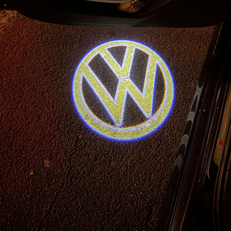 Volkswagen Luci porta Logo originale n. 160 (quantità 1 = 2 pellicole logo / 2 luci porta)