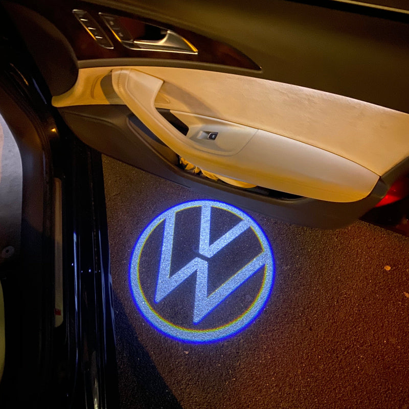 Volkswagen Luci porta Logo originale n. 162 (quantità 1 = 2 pellicole logo / 2 luci porta)