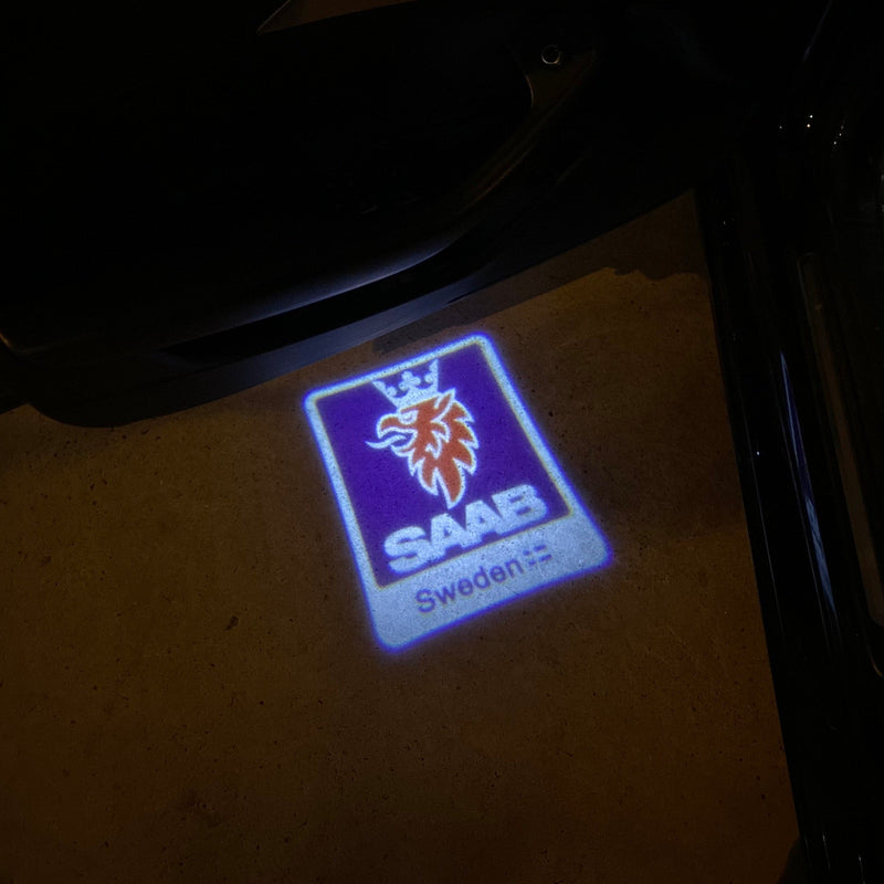 SAAB Original LOGO PROJECROTR LIGHTS Nr.2501 (quantità 1 = 1 set/2 luci porta)