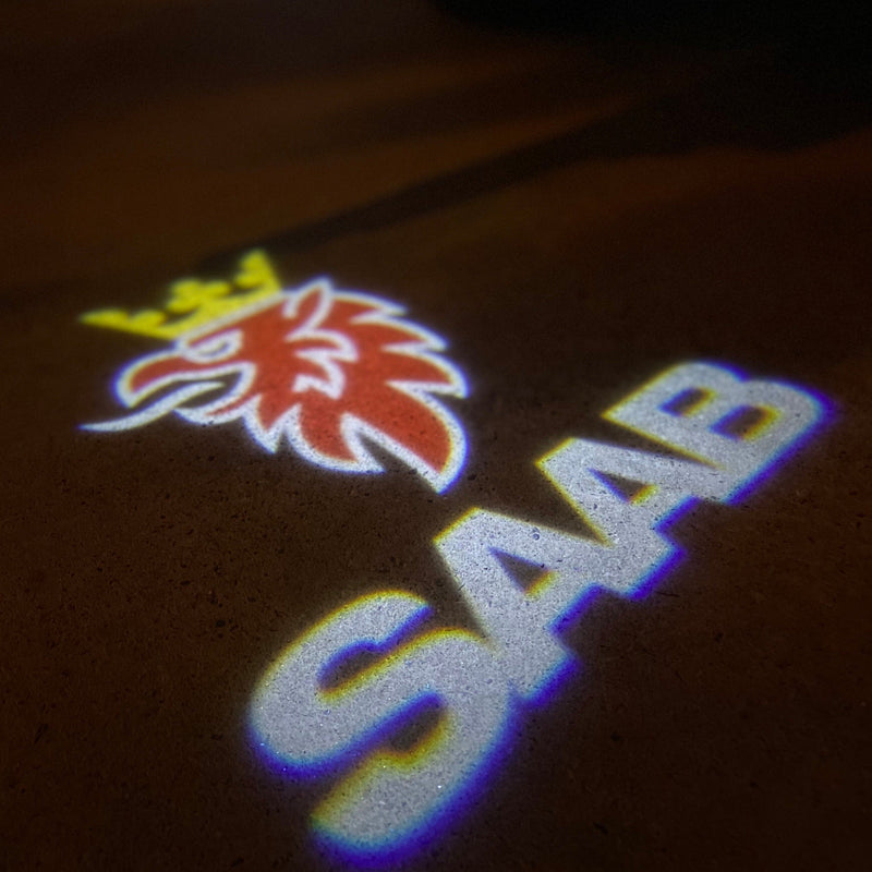 SAAB Original LOGO PROJECROTR LIGHTS Nr.2509 (quantità 1 = 1 set/2 luci porta)