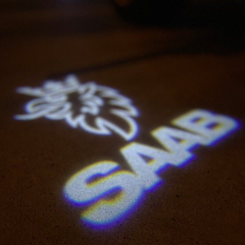 SAAB Original LOGO PROJECROTR LIGHTS Nr.2518 (Menge 1 = 1 Satz/2 Türleuchten)