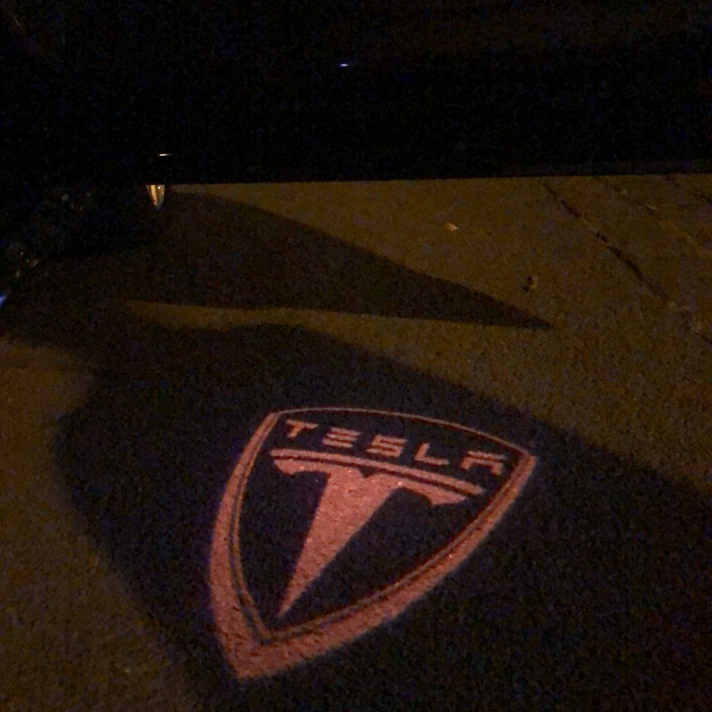 TESLA LOGO PROJECROTR LIGHTS Nr.1507 (quantità 1 = 2 pellicole logo / 2 luci per porta)