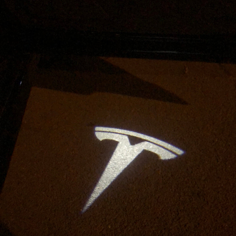 TESLA LOGO PROJECROTR LIGHTS Nr.1518 (quantità 1 = 2 pellicole logo / 2 luci per porta)