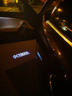 SKODA OCTAVIA LOGO PROJECTOT LIGHTS Nr.83  (quantity  1 =  2 Logo Film /  2 door lights)