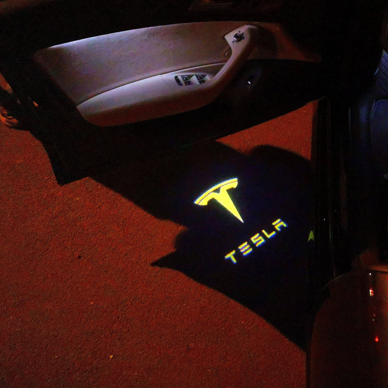 TESLA LOGO PROJECROTR LIGHTS Nr.1512 (quantità 1 = 2 pellicole logo / 2 luci per porta)