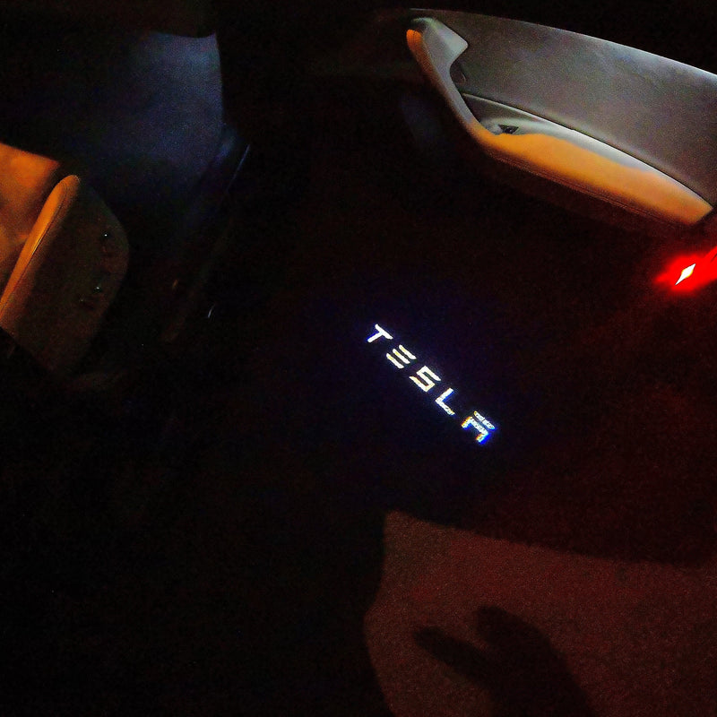 TESLA LOGO PROJECROTR LIGHTS Nr.1516 (quantità 1 = 2 pellicole logo / 2 luci per porta)