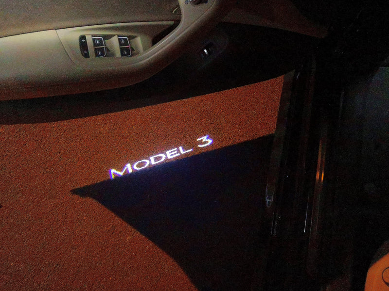 TESLA MODEL 3 LOGO PROJECROTR LIGHTS Nr.1524 (quantità 1 = 2 pellicole logo / 2 luci porta)