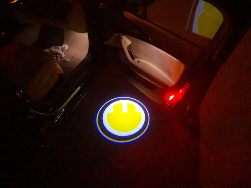 MINI ELECTRIC  LOGO PROJECROTR LIGHTS Nr.81 (quantity  1 =  2 Logo Film /  2 door lights)