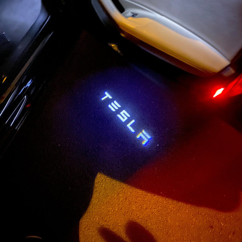 TESLA LOGO PROJECROTR LIGHTS Nr.1503 (quantità 1 = 2 pellicole logo / 2 luci porta)