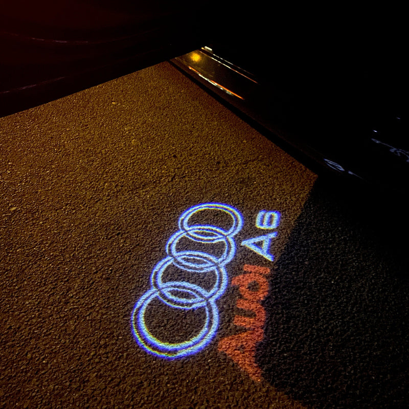 AUDI A6 LOGO PROJECTOT LIGHTS Nr.44 (quantità 1 = 2 pellicole logo /2 luci porta） 