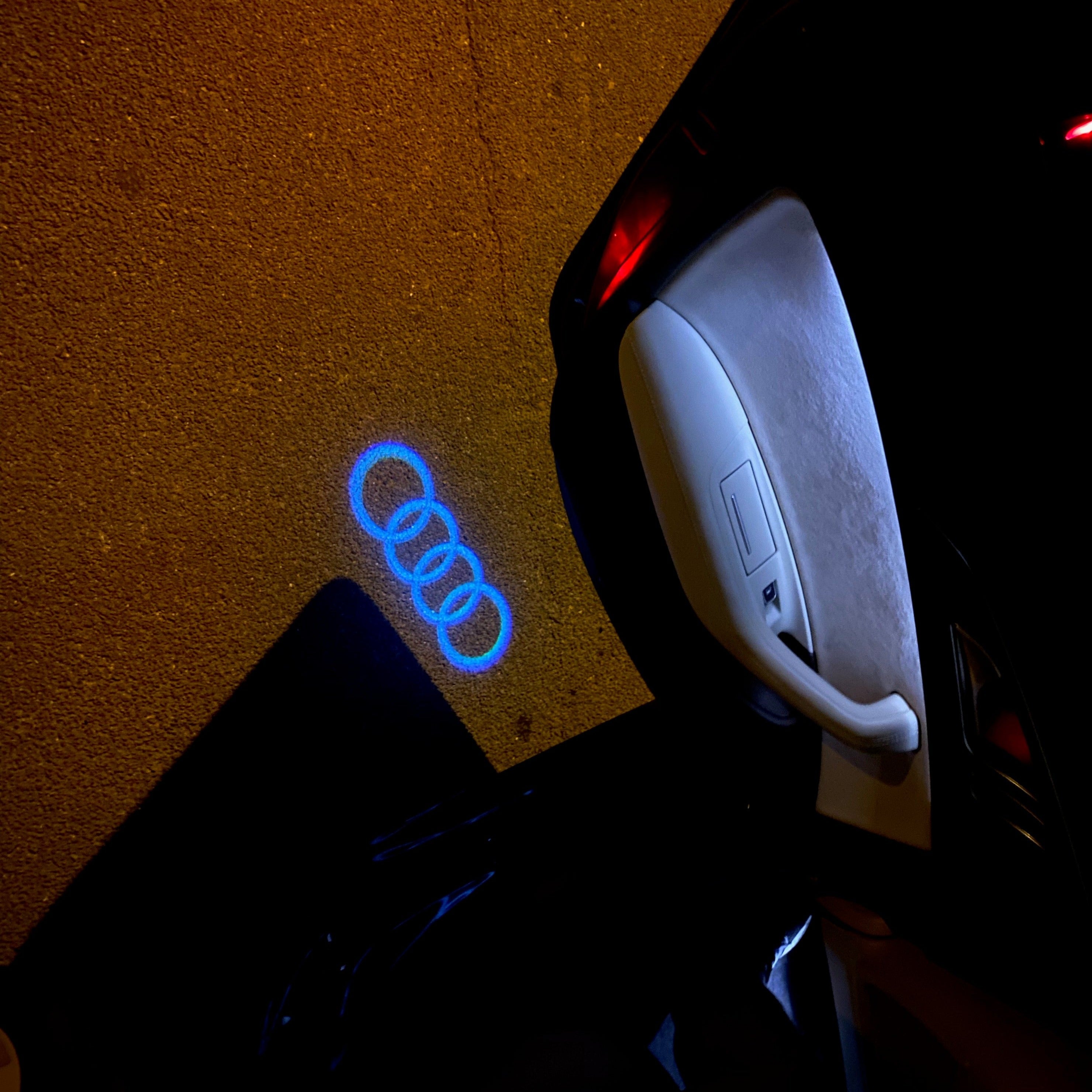 AUDI 4 RINGS LOGO PROJECTOT LIGHTS Nr.08  (quantity 1 = 2 Logo Films /2 door lights）
