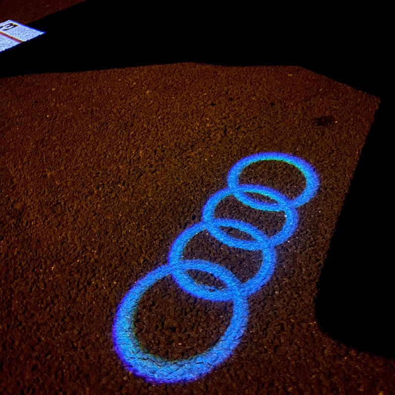 AUDI 4 RINGS LOGO PROJECTOT LIGHTS Nr.08  (quantity 1 = 2 Logo Films /2 door lights）