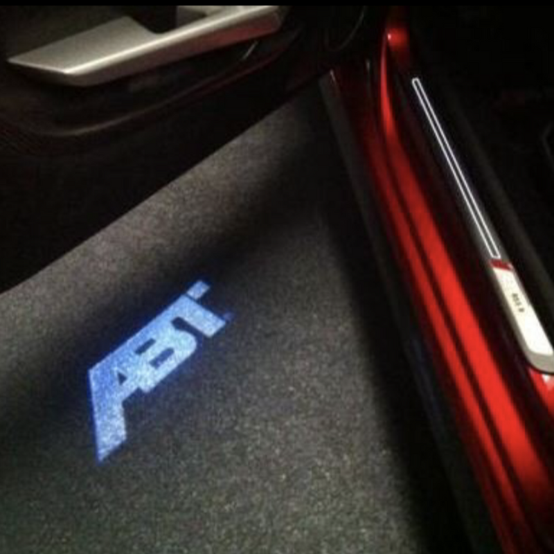 AUDI ABT LOGO PROJECROTR LIGHTS Nr.123 (quantità 1 = 2 pellicole con logo e 2 luci per portiere) 