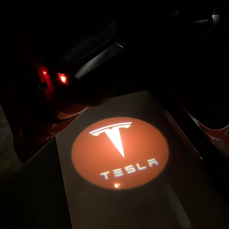 TESLA LOGO PROJECROTR LIGHTS Nr.1515 (quantità 1 = 2 pellicole logo / 2 luci per porta)