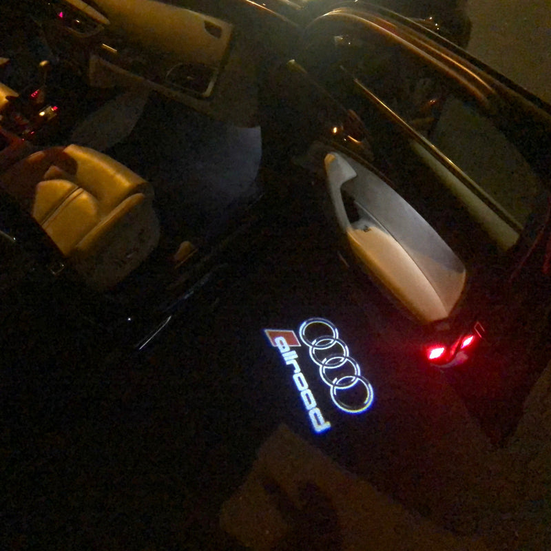 AUDI ALLROAD LOGO PROJECTOT LIGHTS Nr.146 (quantità 1 = 2 pellicole logo /2 luci porta） 