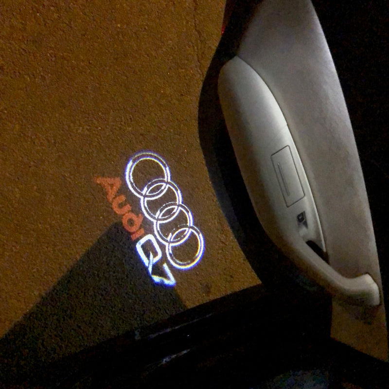 AUDI Q7 LOGO PROJECTOT LIGHTS Nr.49 (quantità 1 = 2 pellicole logo /2 luci porta） 