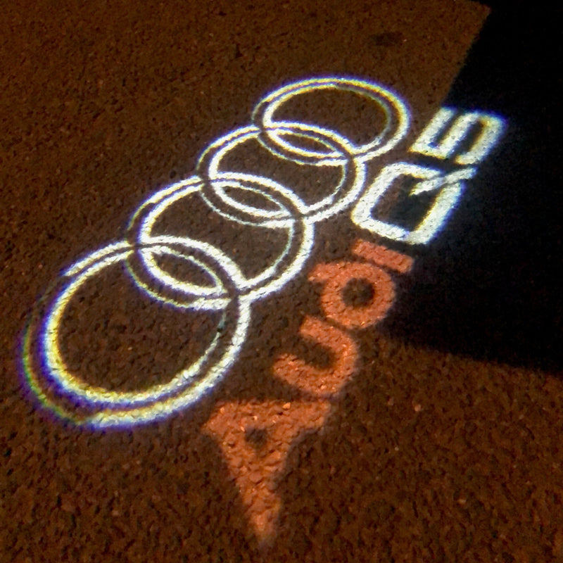 AUDI Q5 LOGO PROJECTOT LIGHTS Nr.48 (quantità 1 = 2 pellicole logo /2 luci porta） 