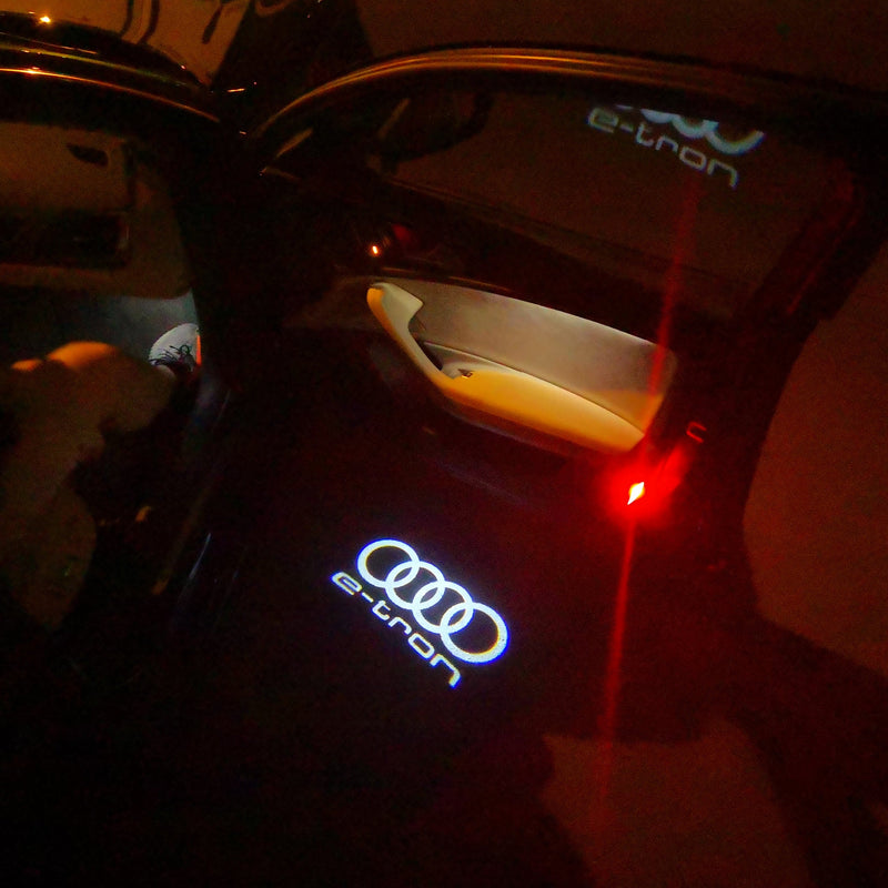 AUDI E-TRON LOGO PROJECTOT LIGHTS Nr.16 (quantità 1 = 2 pellicole logo /2 luci porta） 