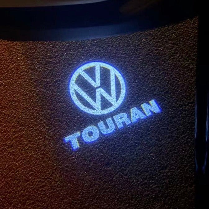 Volkswagen Luci porta TOURAN Logo Nr. 162 (quantità 1 = 2 pellicole logo / 2 luci porta)