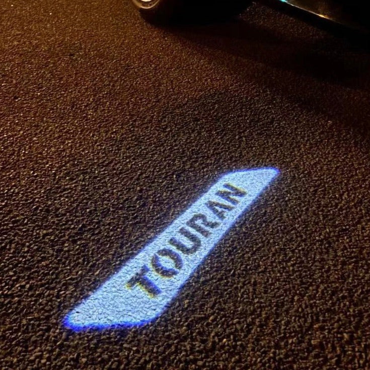 Volkswagen Luci porta TOURAN Logo Nr. 176 (quantità 1 = 2 pellicole logo / 2 luci porta)